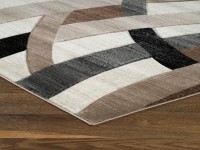 PLUSH PILE RUG IN A PATTERN OF OVERLAPPING WAVES IN SUBTLE EARTH TONES 2 SIZES