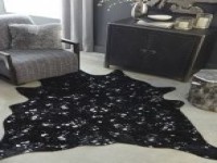 FAUX FUR COWHIDE SHAPED RUG IN BLACK WITH GOLD ACCENTS 5 X 7